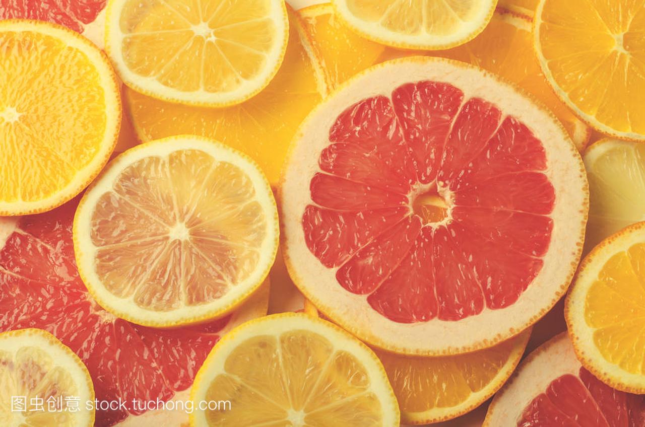 柑橘类水果片柠檬、 橘子、 葡萄柚为背景
