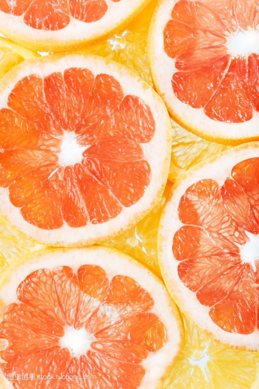 柑橘类水果橘子和葡萄柚切片背景