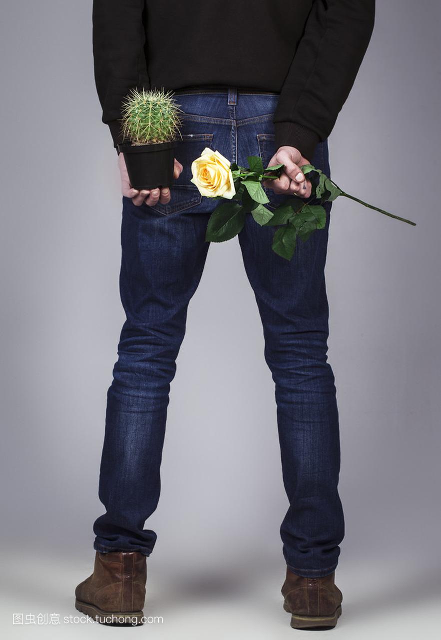 Handsome man Standing with Holding a Rose 