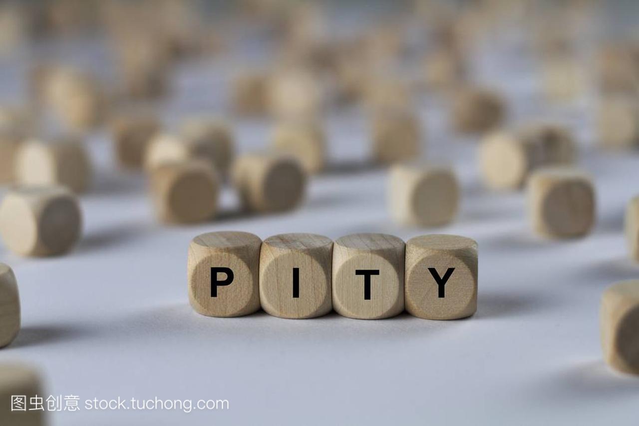 pity  cube with letters, sign with wooden cubes