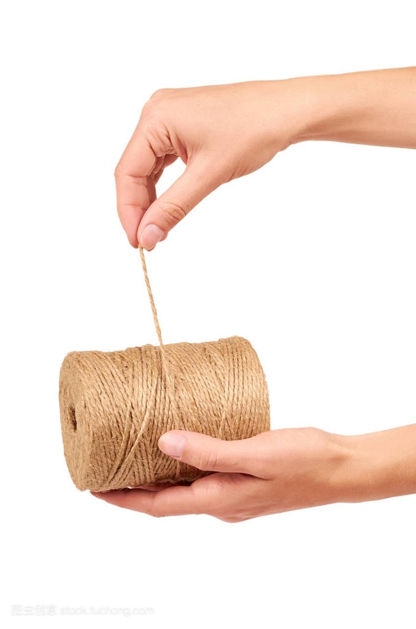 Spool of bale twine isolated in hand on 