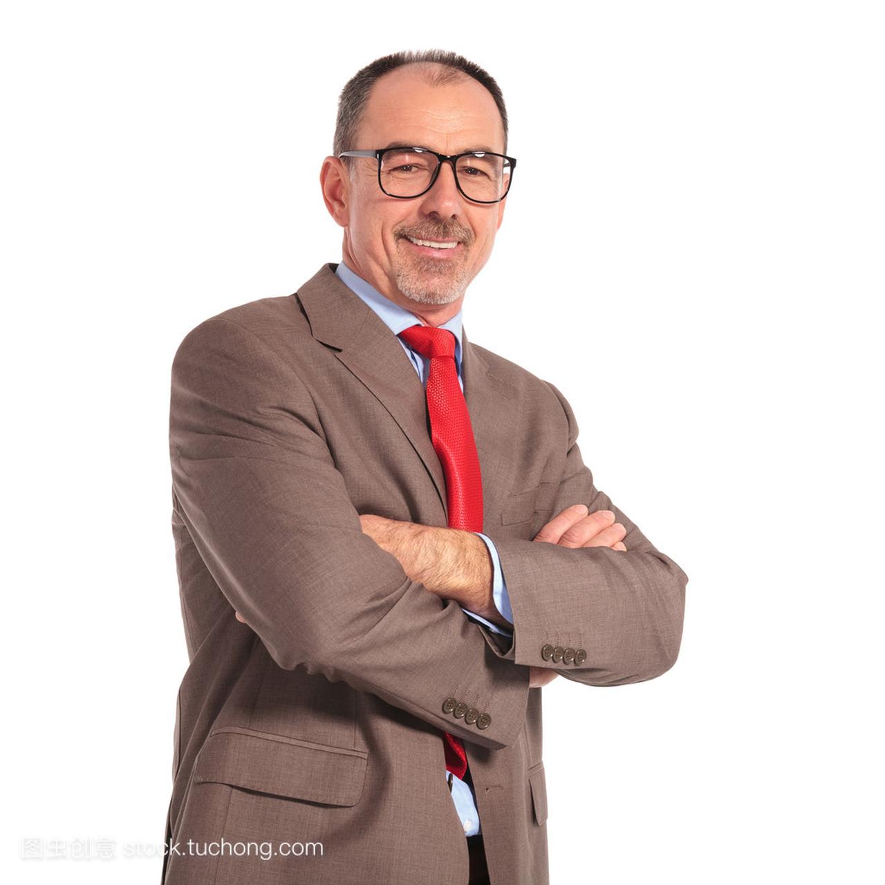 confident old businessman with glasses standin