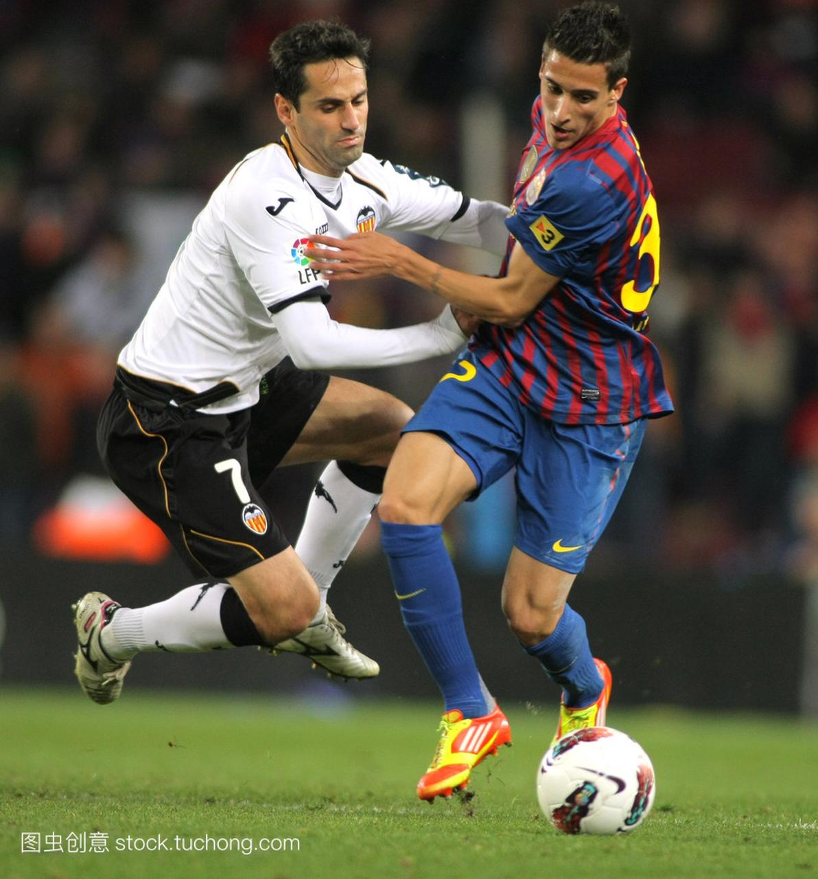 lves of Valencia CF vies with Cristian Tello of FC Barcelona