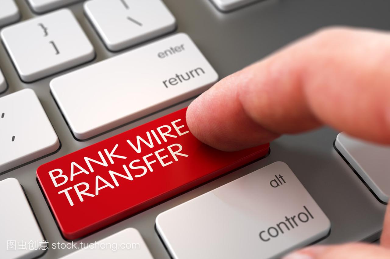 Hand Touching Bank Wire Transfer Key.