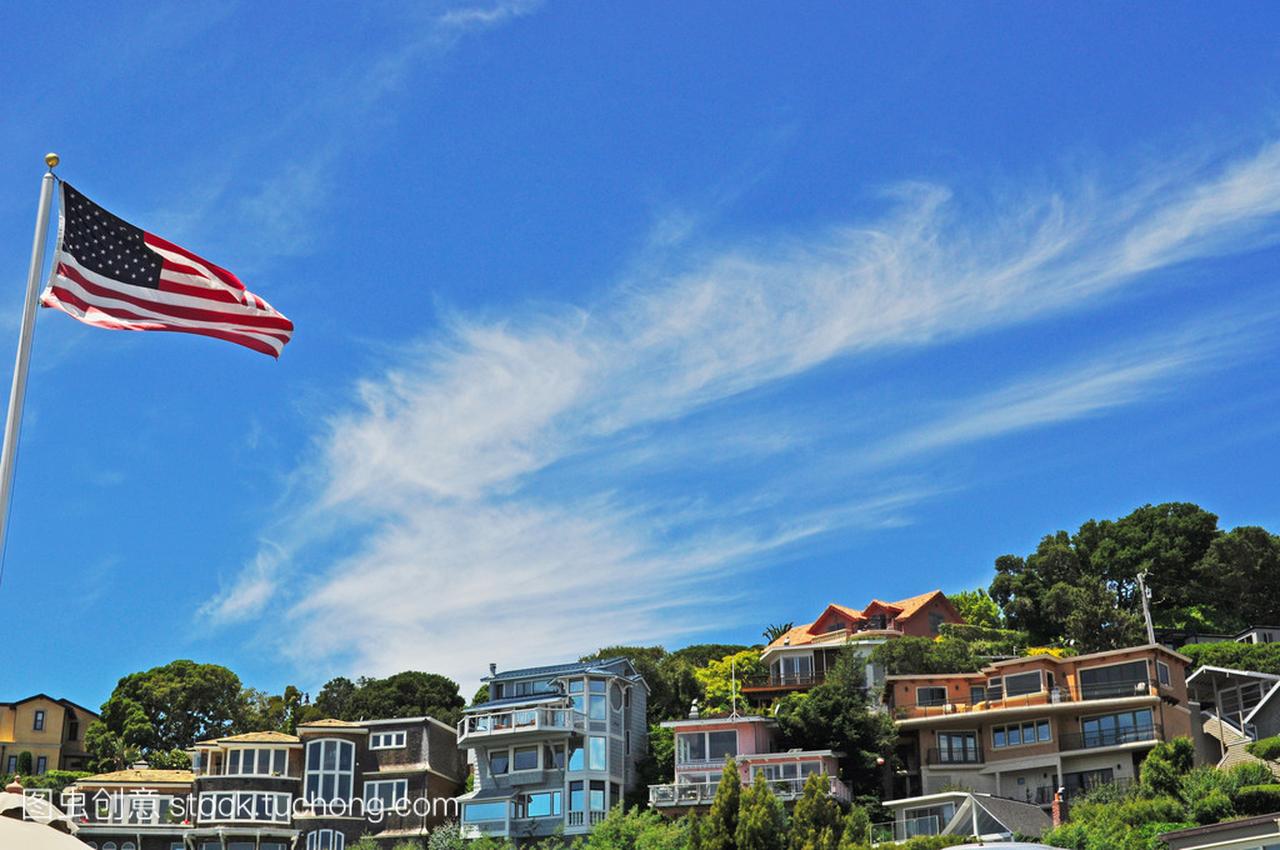 California: waving flag and houses on the green