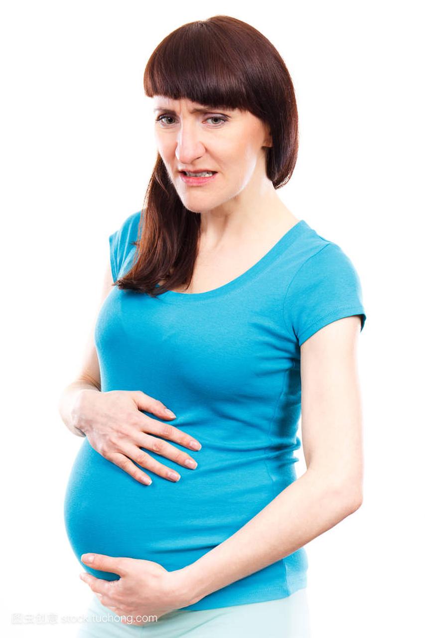 悲伤的孕妇胃痛摸她的肚子,痛在怀孕和流产的