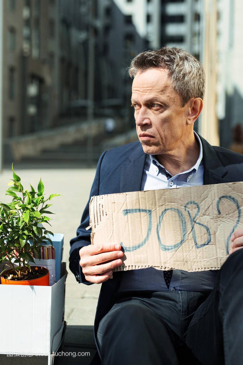 Brokenhearted fired man searching job outside