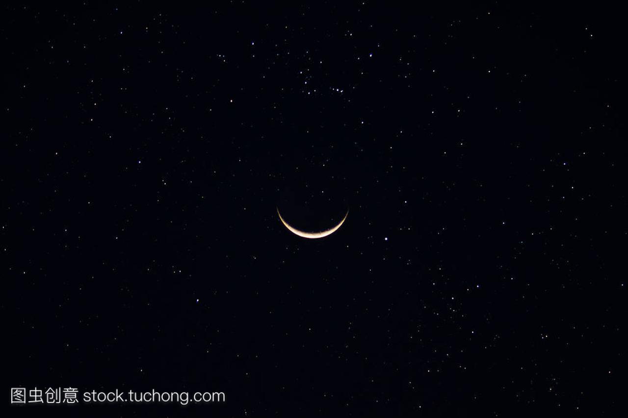 Crescent moon in the dark night with star.