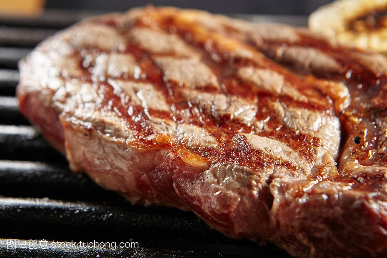Hot Whole Grilled Ribeye Beef Steak on 