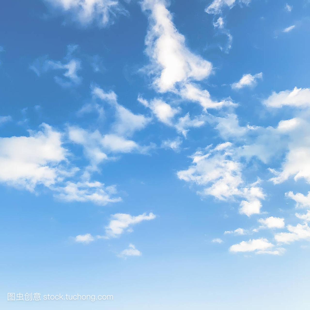 Innocent blue sky with white fluffy clouds