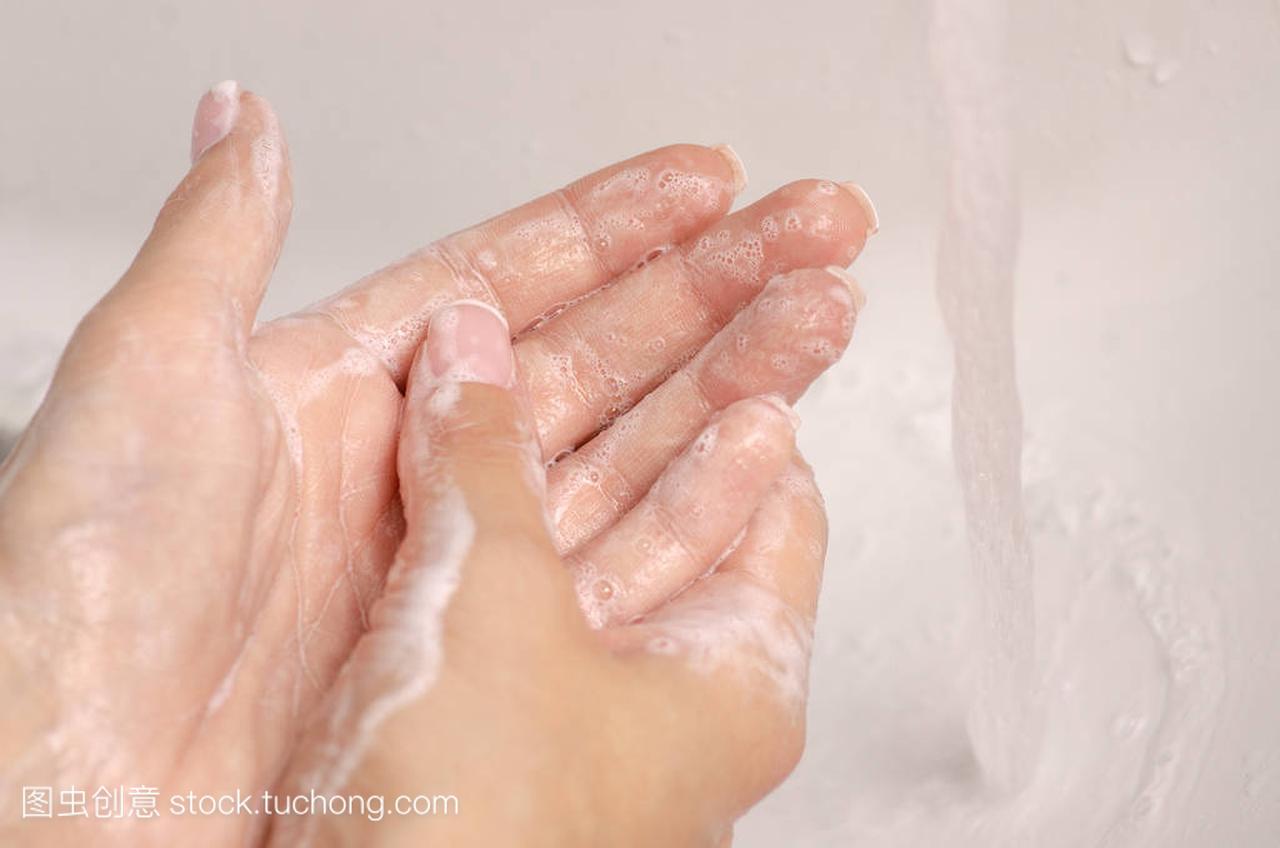 Washing hands in the washbasin soap water ba