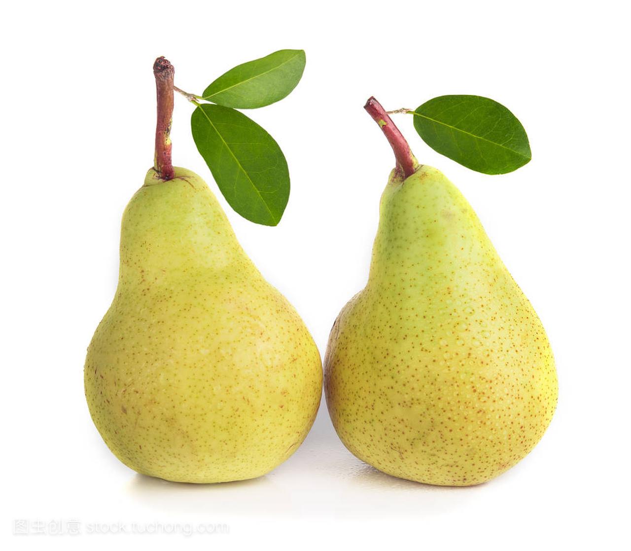 Two pears with green leaves isolated on white background.