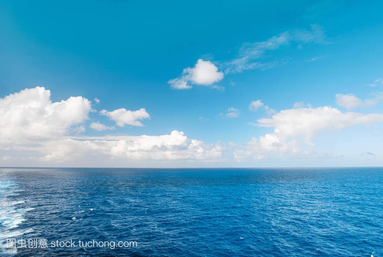 Sea water and perfect blue sky with white cloud