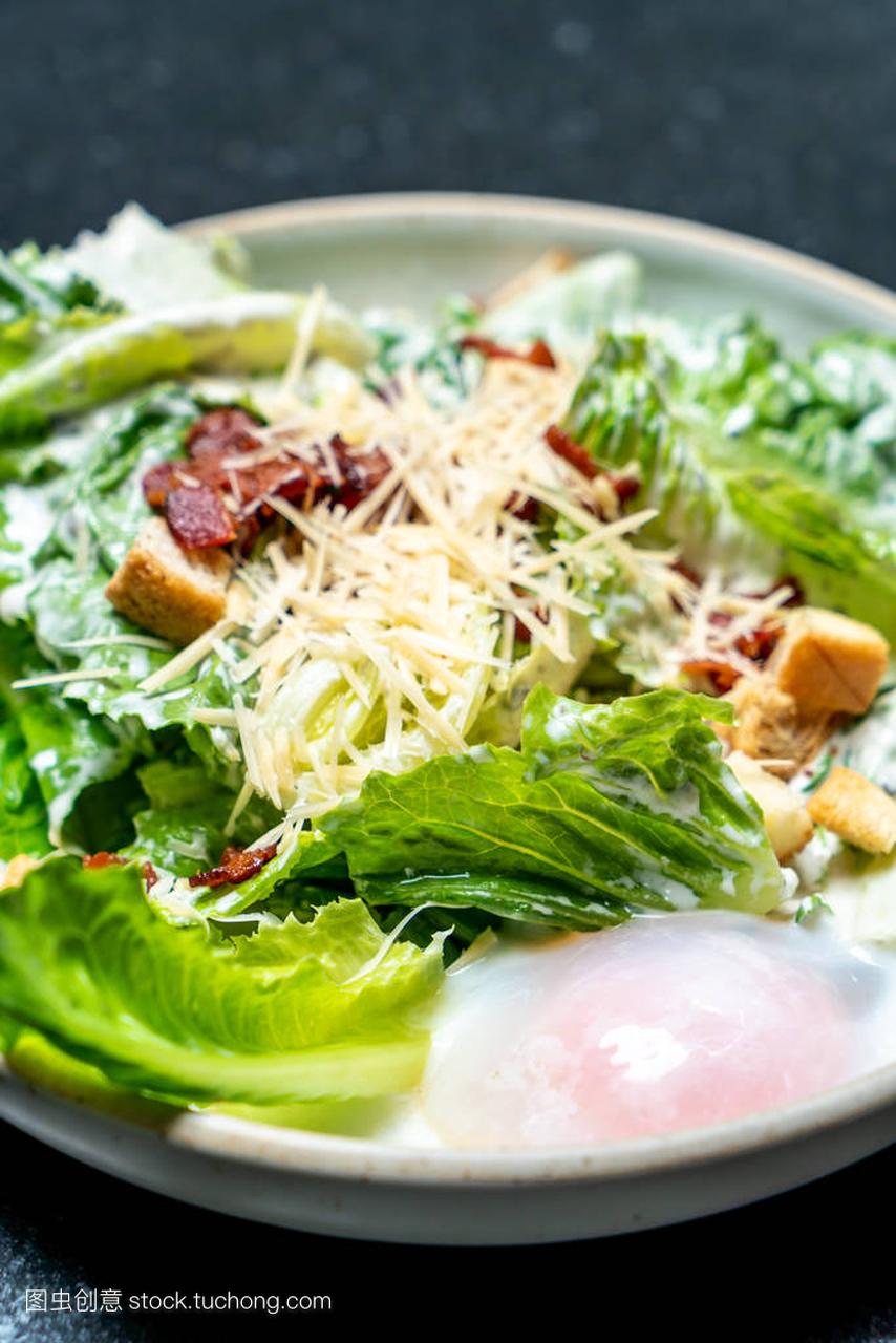 Caesar salad bowl with egg - healthy food style