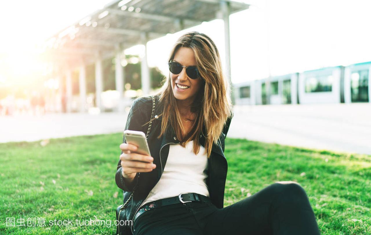 aucasian female wearing sunglasses chatting o