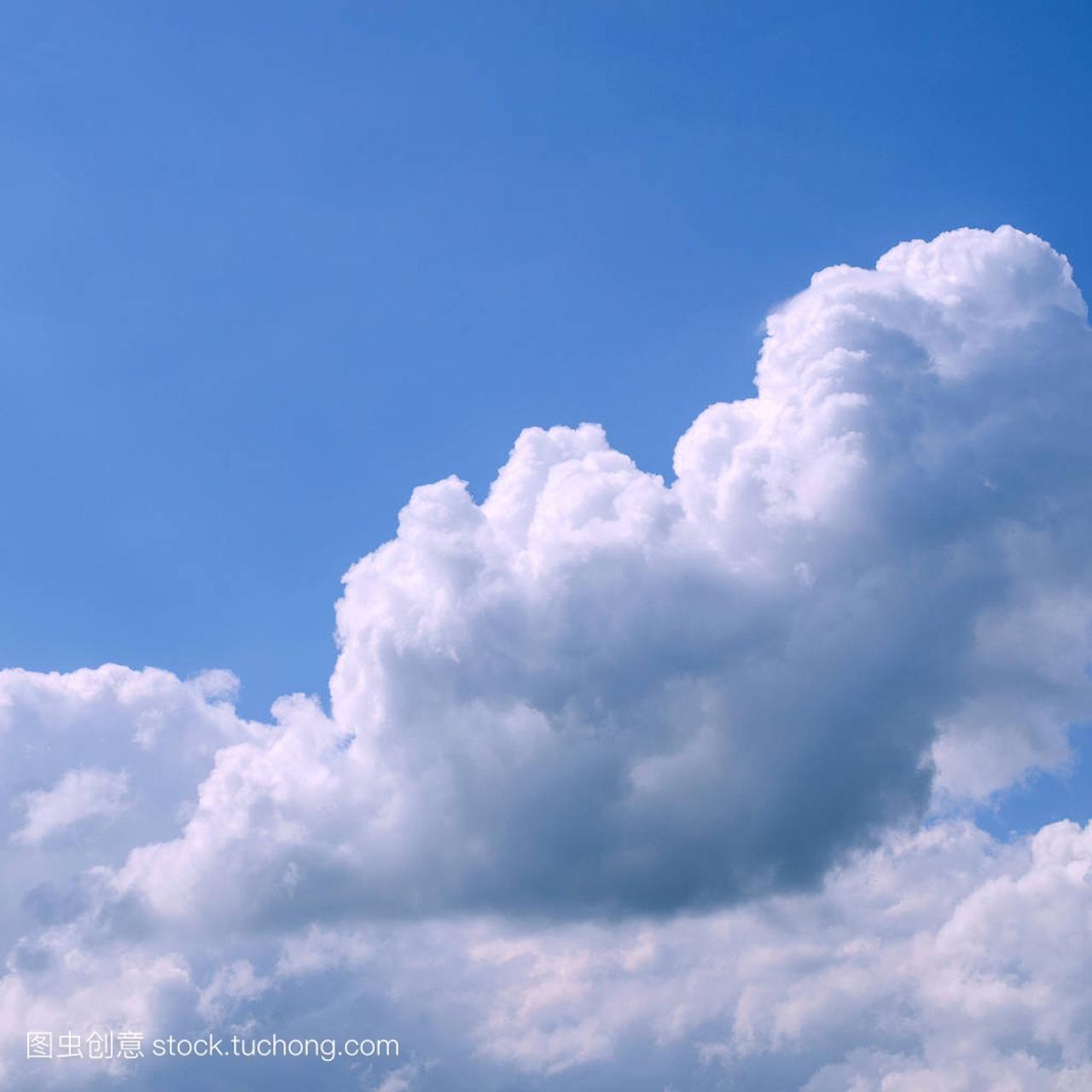 White fluffy clouds in the vast blue sky. Abstract