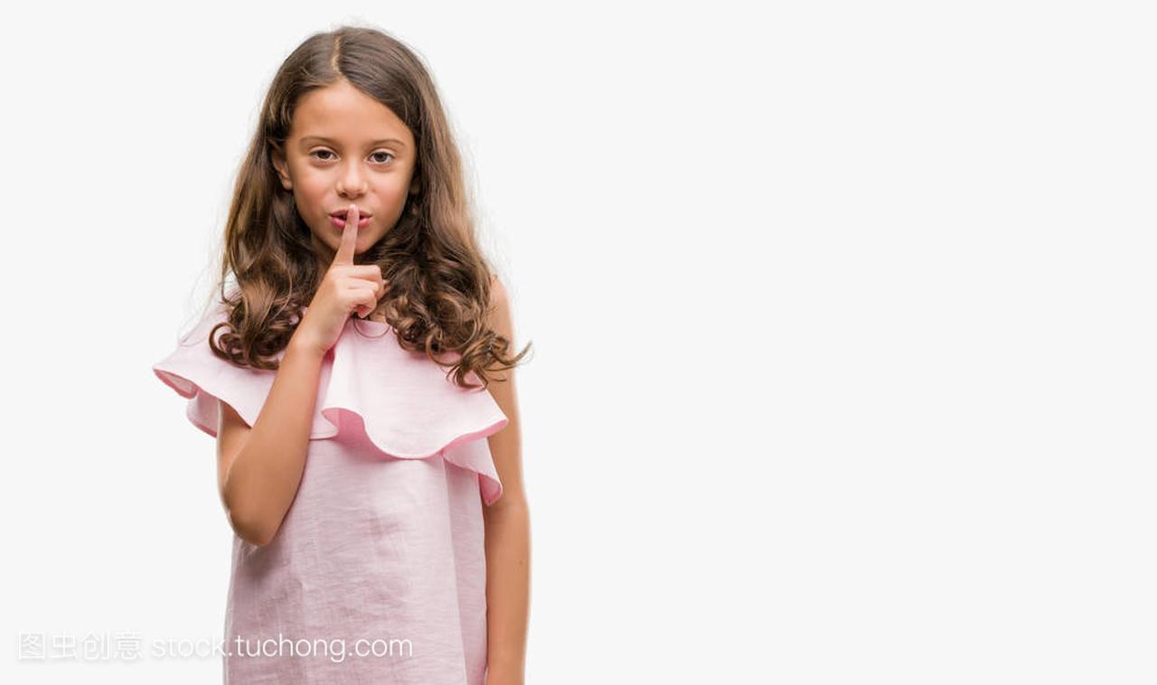 girl wearing pink dress asking to be quiet 