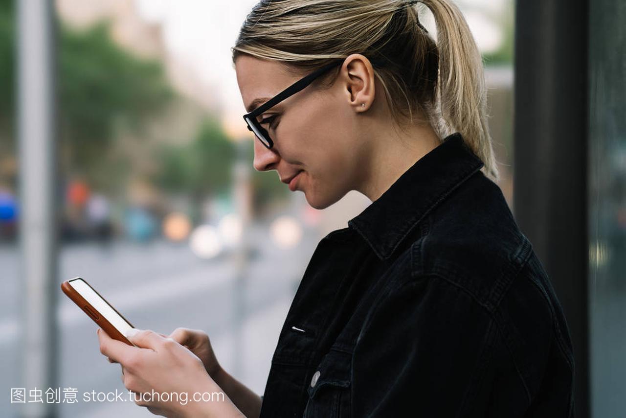 ositive hipster girl laughing while chatting with fo