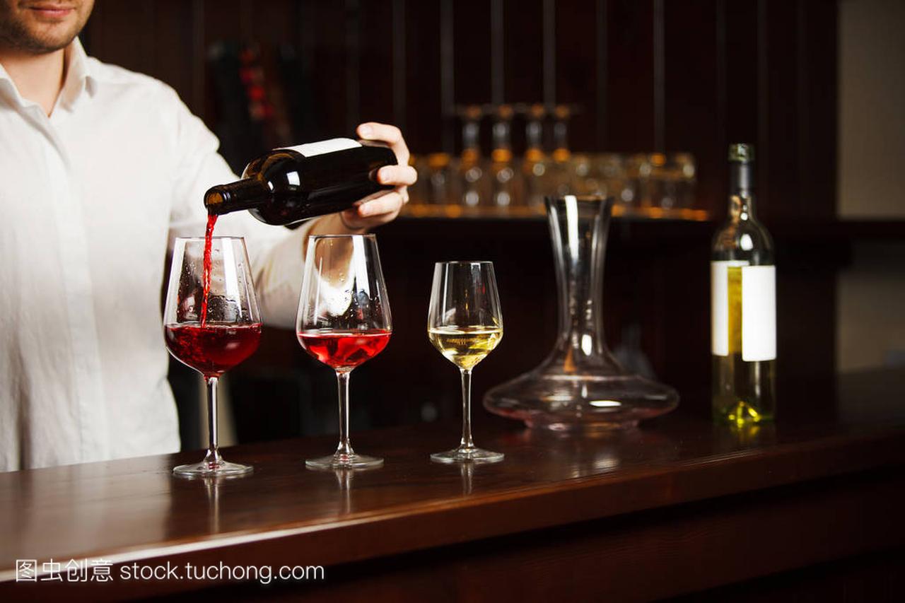 Sommelier pouring different types of fine wine