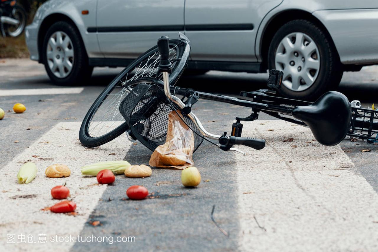 Groceries and broken bike on pedestrian cross