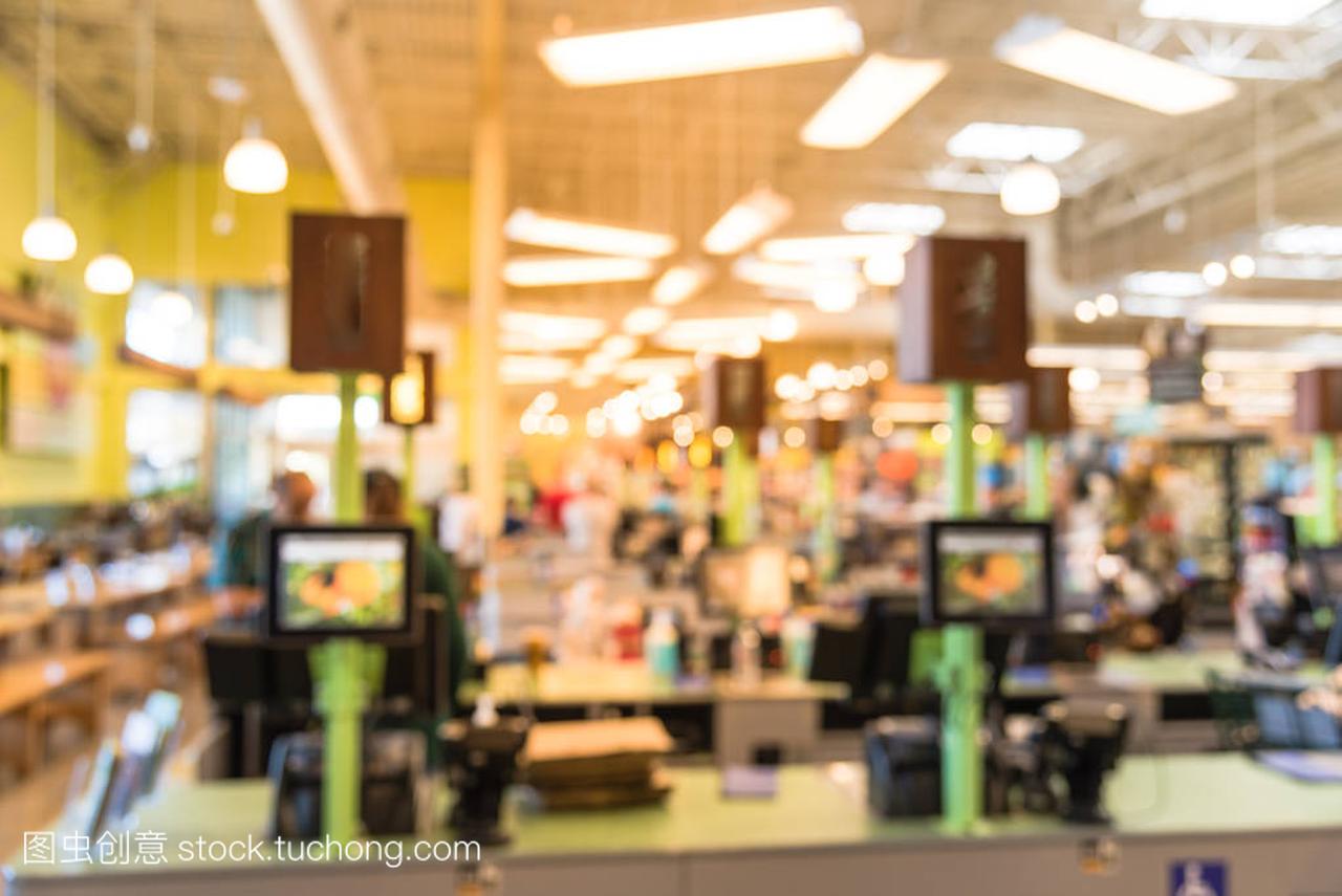 Blur image cashier with line of people at check-