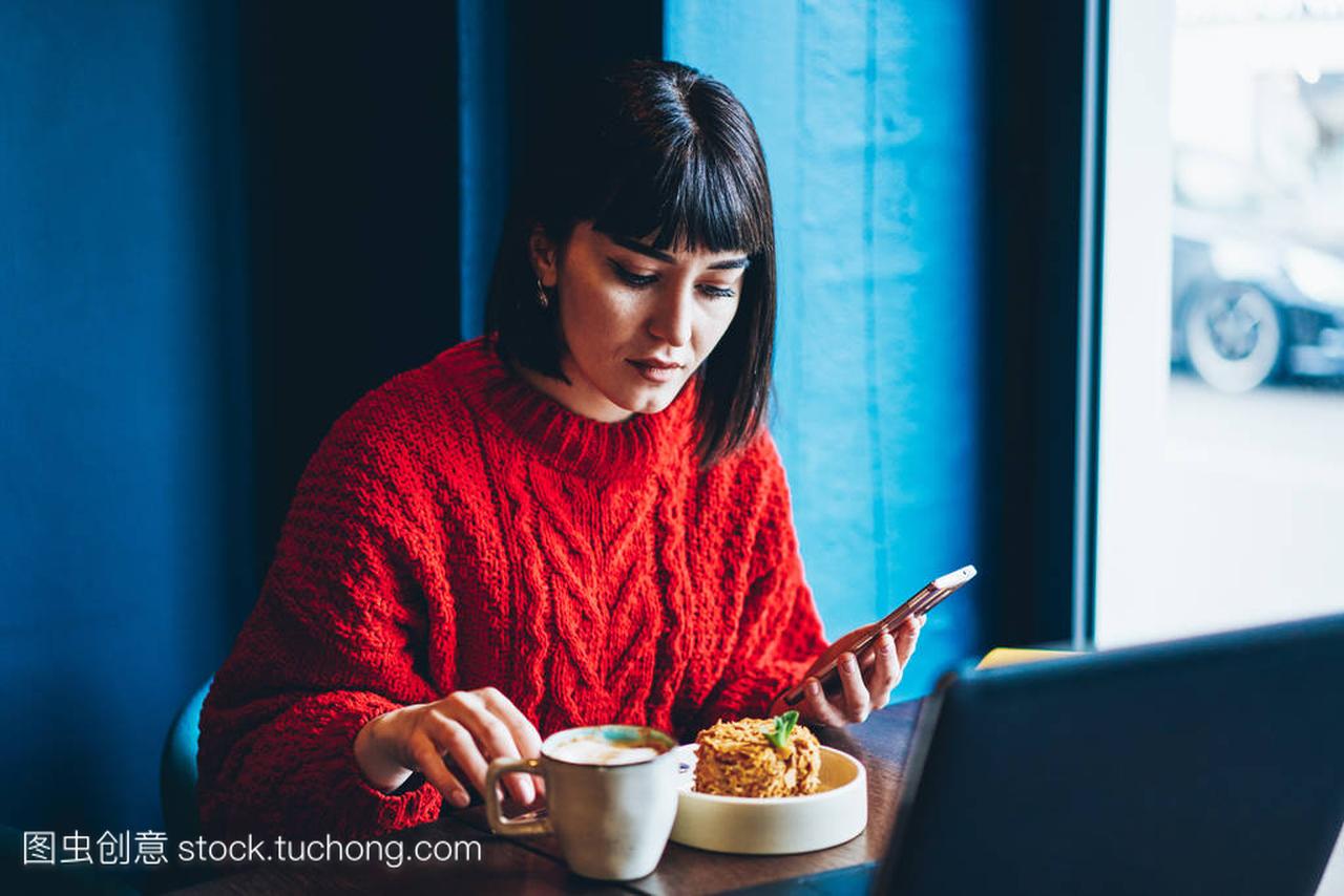 Serious millennial hipster girl chatting with frien