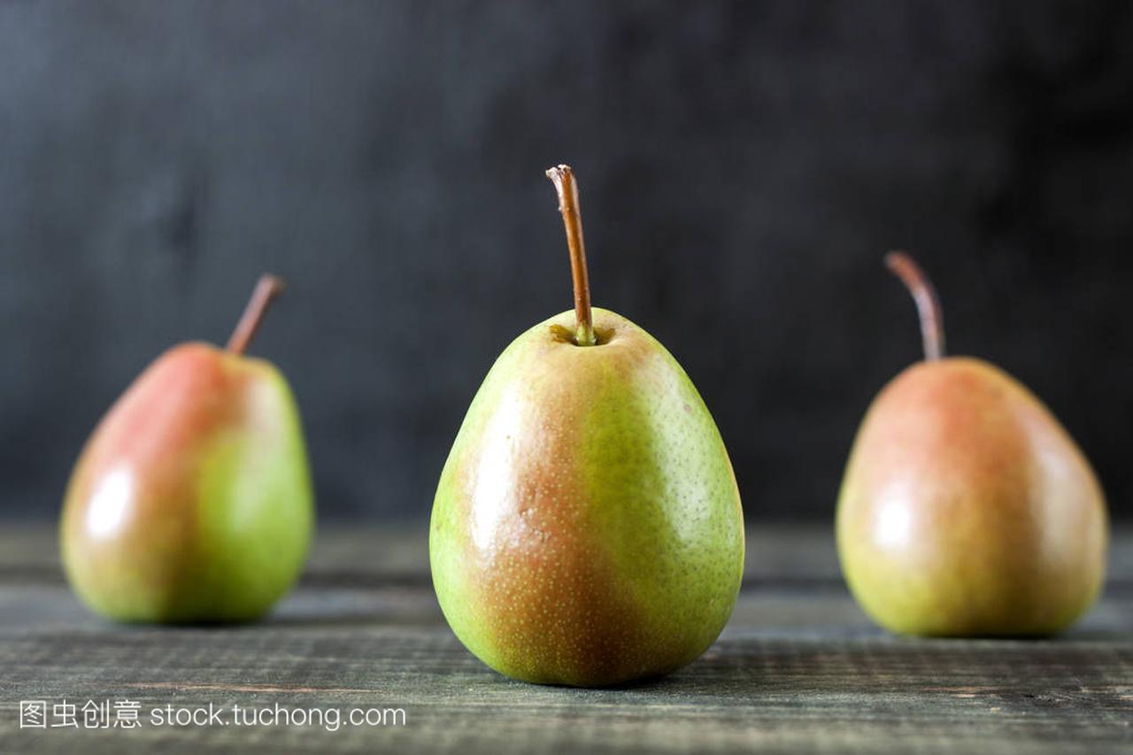 A couple of Fresh ripe organic pears on rustic w