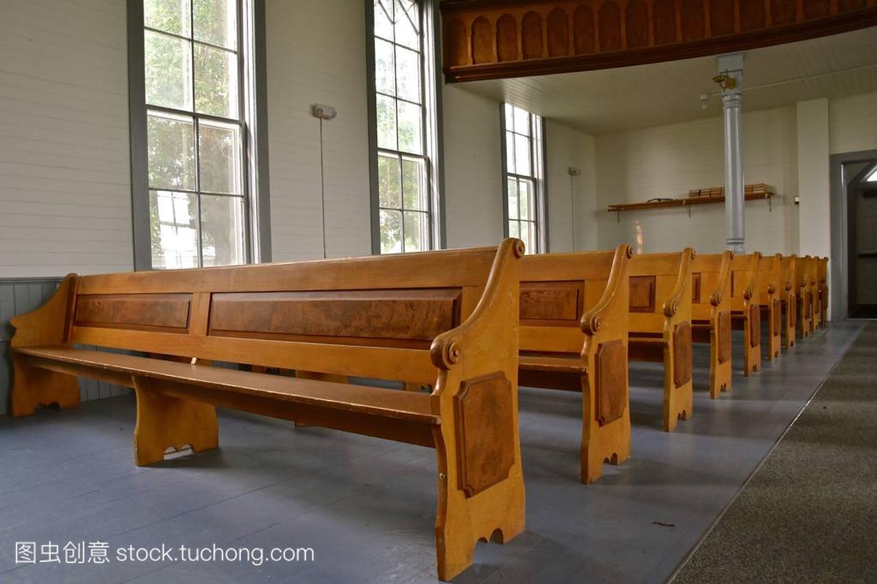 Rows of old wooden pews in a historic Lutheran