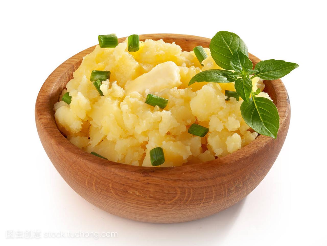 basil and greein onion in the wooden bowl