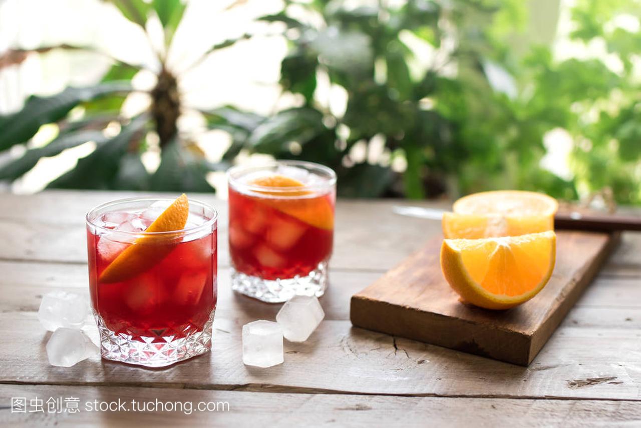 Negroni Cocktail with orange and ice. Homema