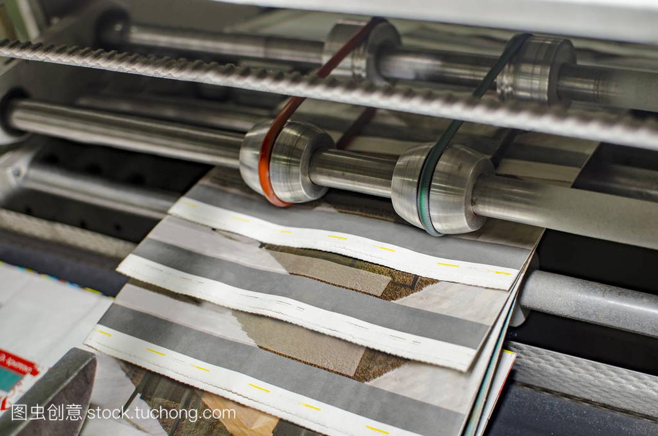 Stack of magazines on offset printing machine 